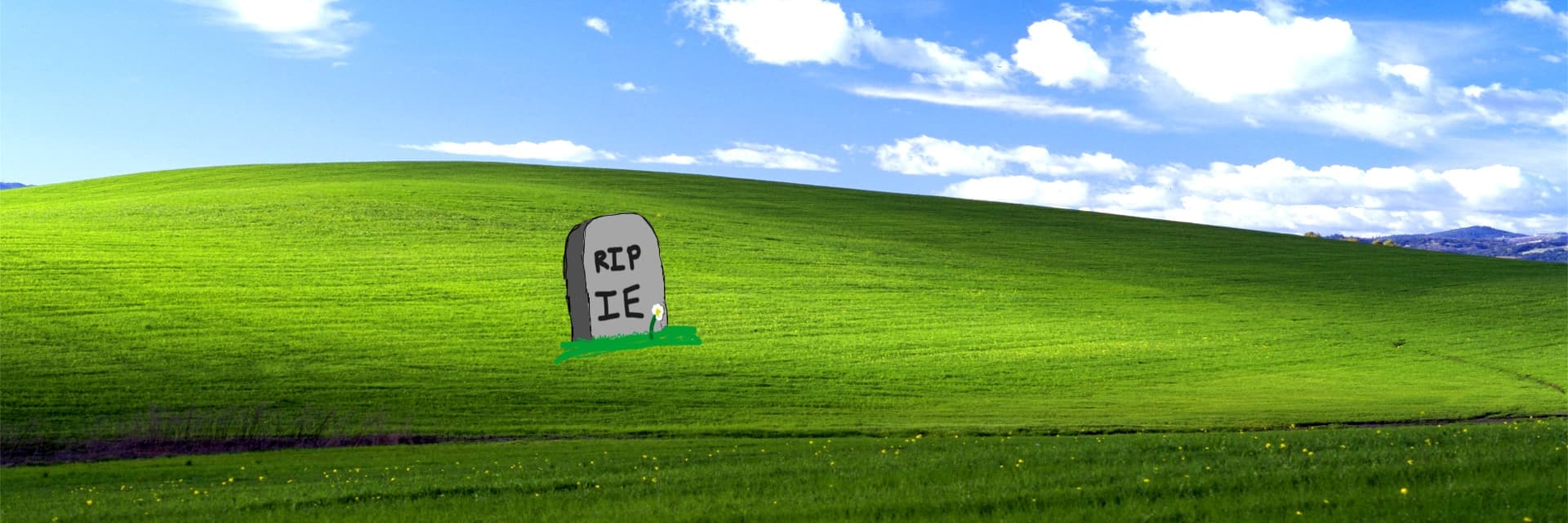 A really beautiful MS paint drawing of a gravestone in a grass field. The gravestone reads, R.I.P. I.E.